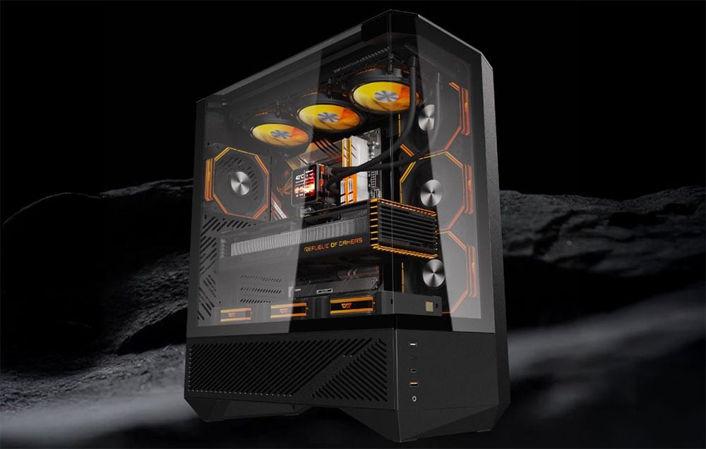 Gaming computer with yellow-orange RGB backlighting on a futuristic lunar landscape background