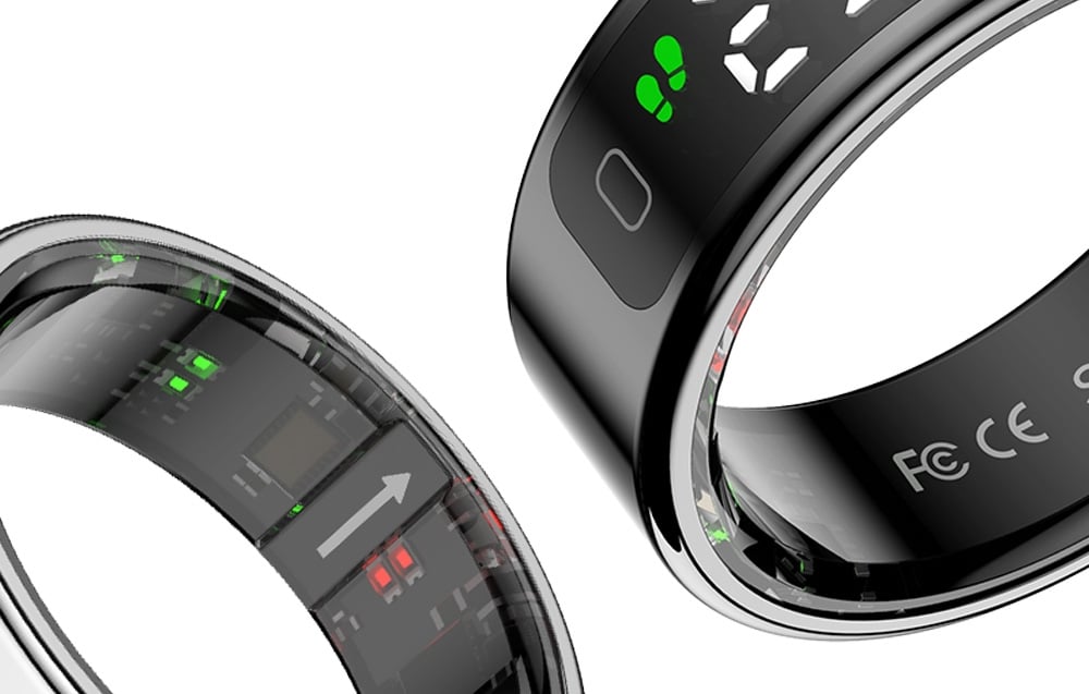2 black smartring with sensors on white background.