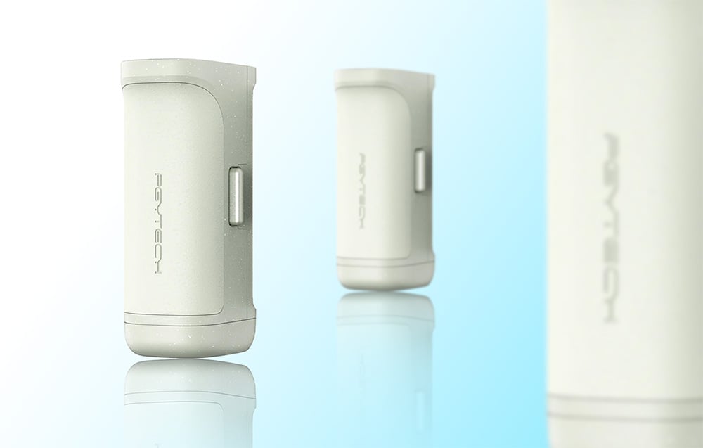 Three light green PGYTECH devices in different sizes with reflections on a bright background with blue accents