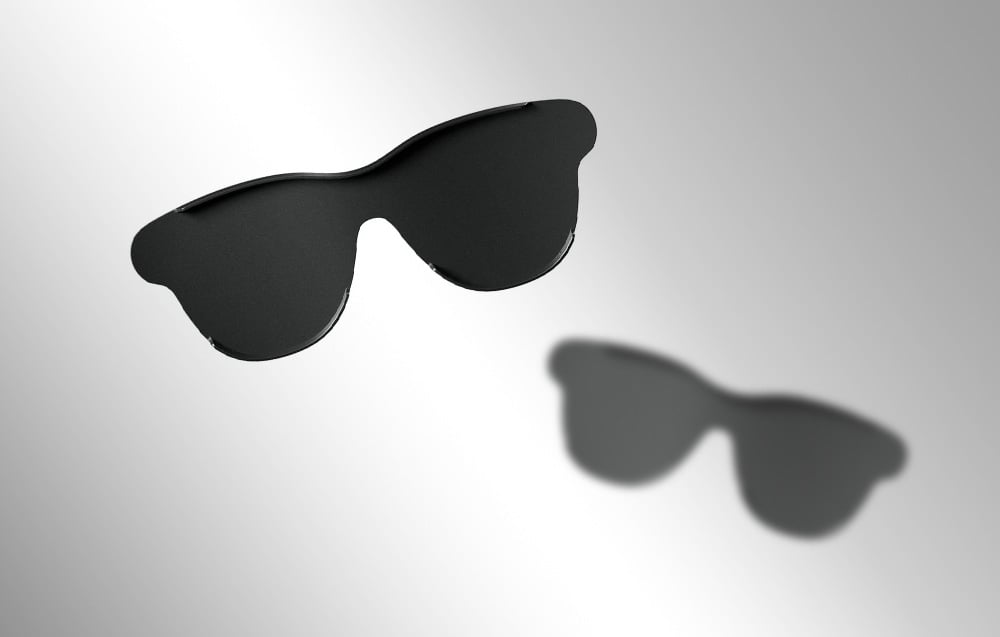 Two pairs of tinting overlays for RayNeo Air 3s Pro eyeglasses on light background, one fuzzy.