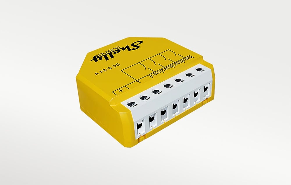 The yellow Shelly switch shown from the side and from above. Visible terminal screws, wiring diagrams, and technical labels on the housing.