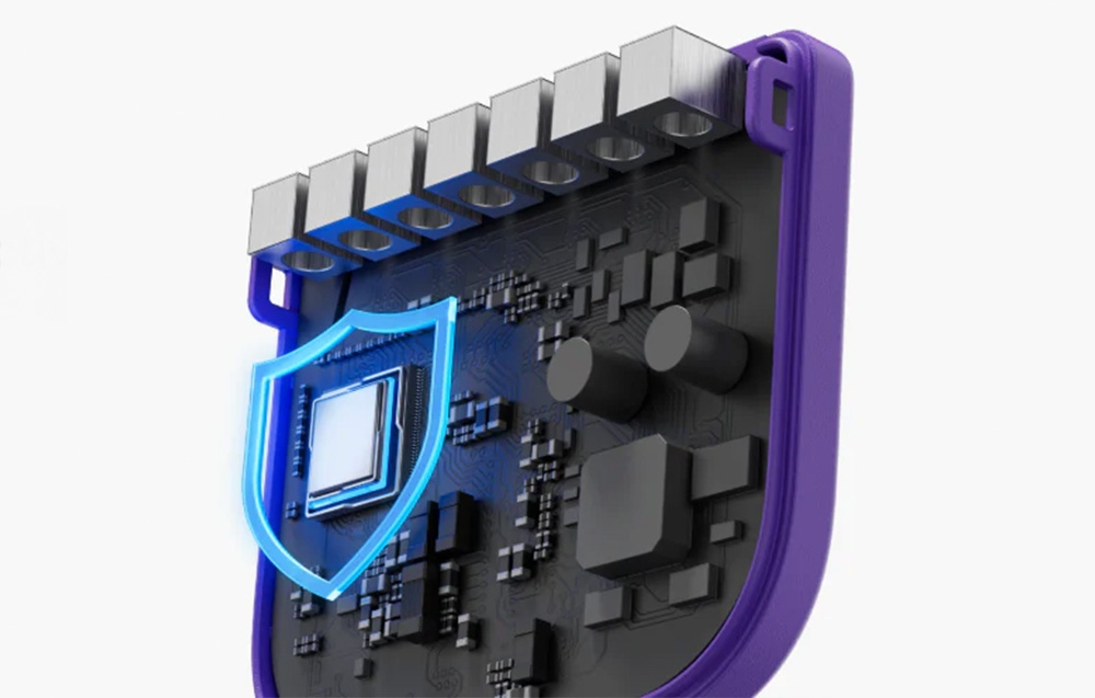 Perspective view of electronic module with chip in blue cover, black components and purple housing