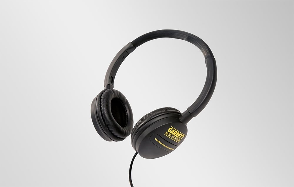 Black over-ear headphones with the company logo and cable, presented on a light background.