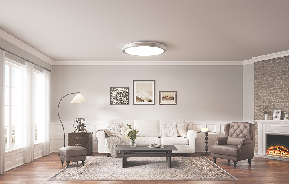 Bright living room with white sofa, fireplace and Yeelight Jupiter D C500 lamp emitting white light.