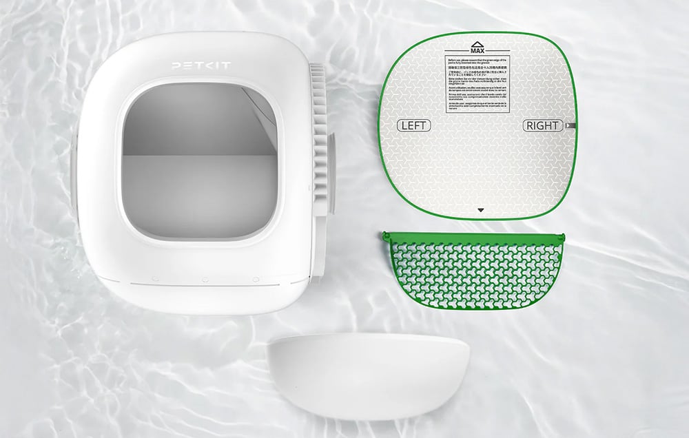 Disassembled parts of a PETKIT automatic litter box arranged on a light background to show how easy it is to clean