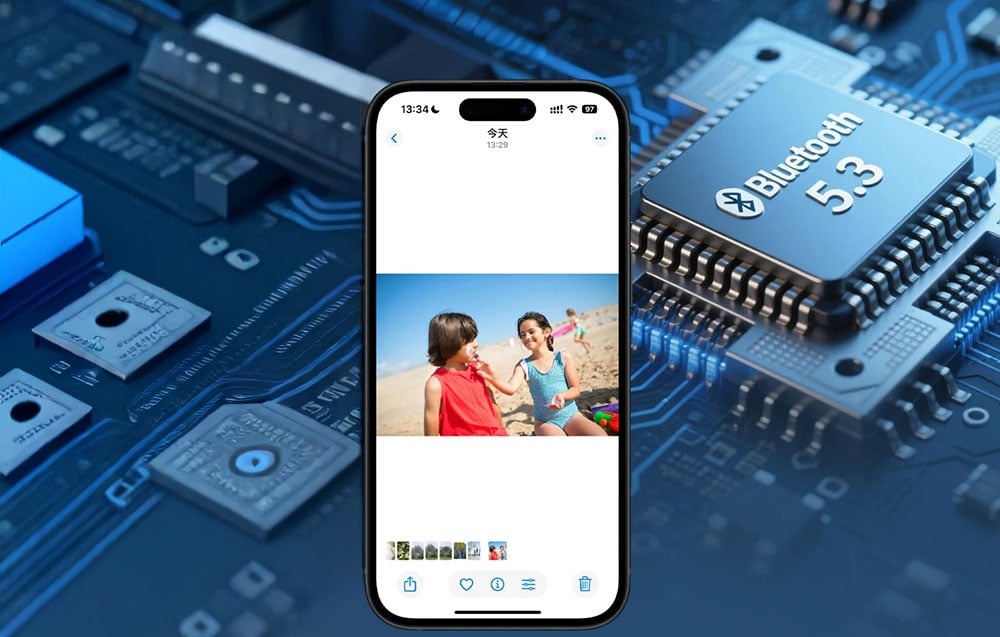A smartphone displaying a photo of children on the beach, placed next to a processor with the inscription