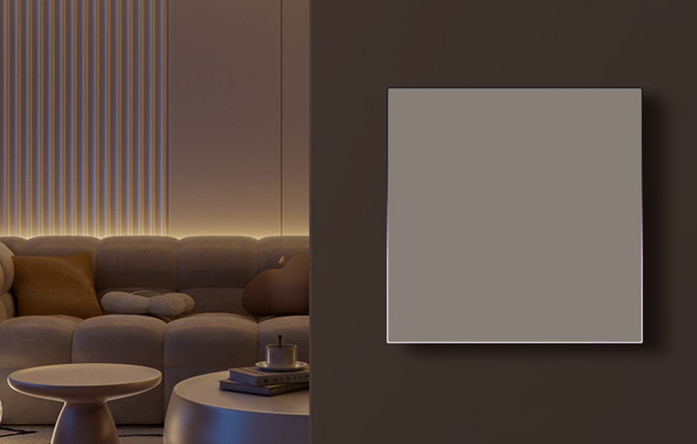 Heating panel on a dark wall in a cozy living room with sofa, coffee table and warm LED lighting under the ceiling
