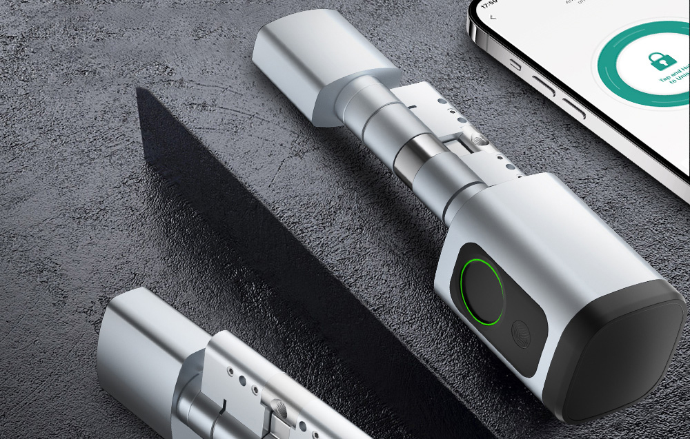 2 silver digital lock cylinder and smartphone on black table