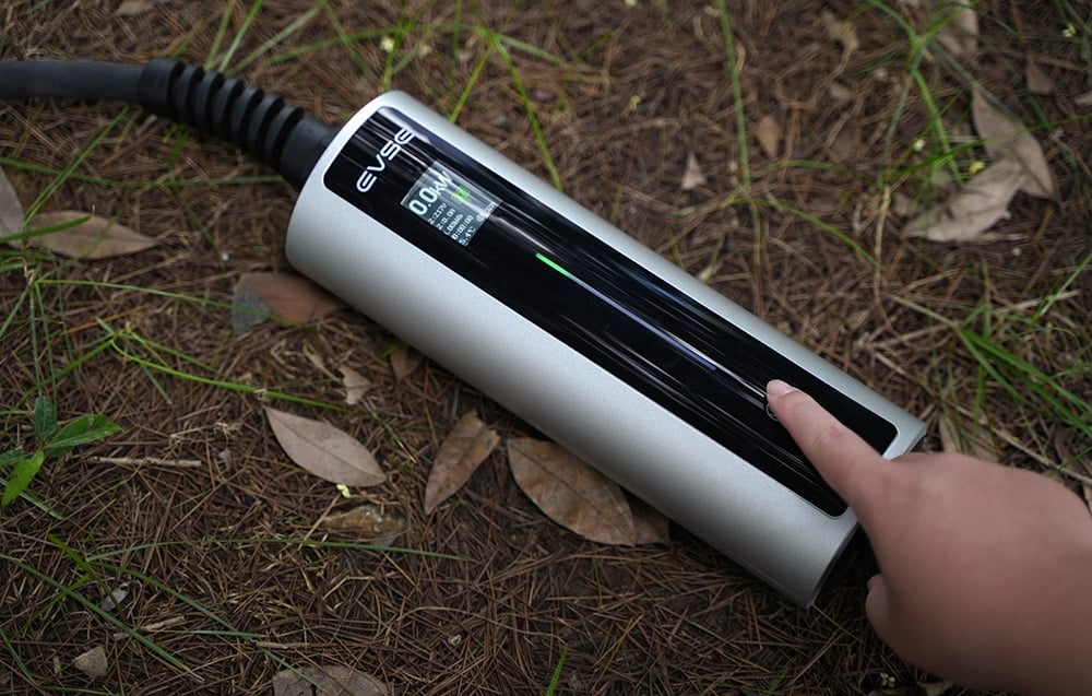 The EV charger is lying on the ground