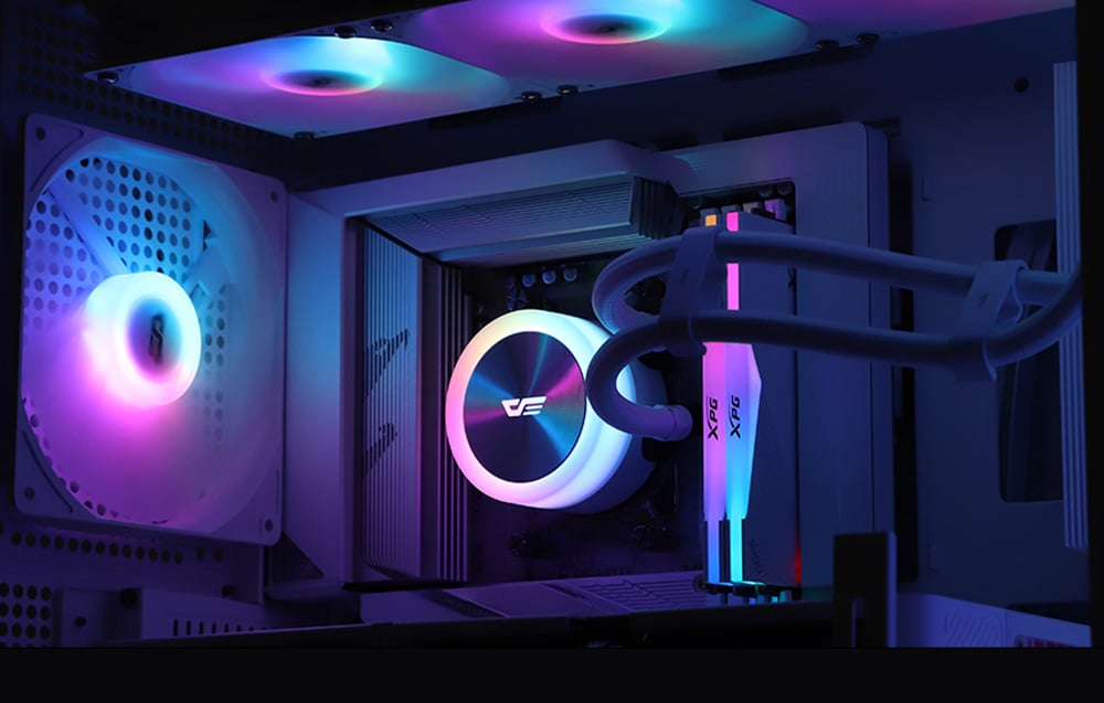 Interior of a computer case with an AIO water cooling system in operation, RAM, and RGB-backlit fans