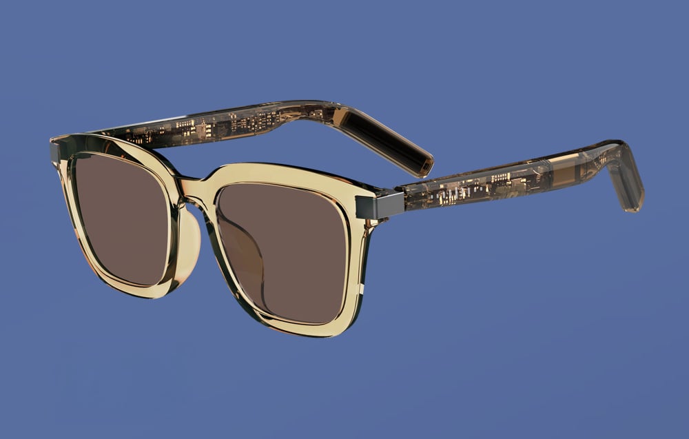 Smart glasses with amber, semi-transparent frames and visible integrated circuits in the temples, on a blue background.