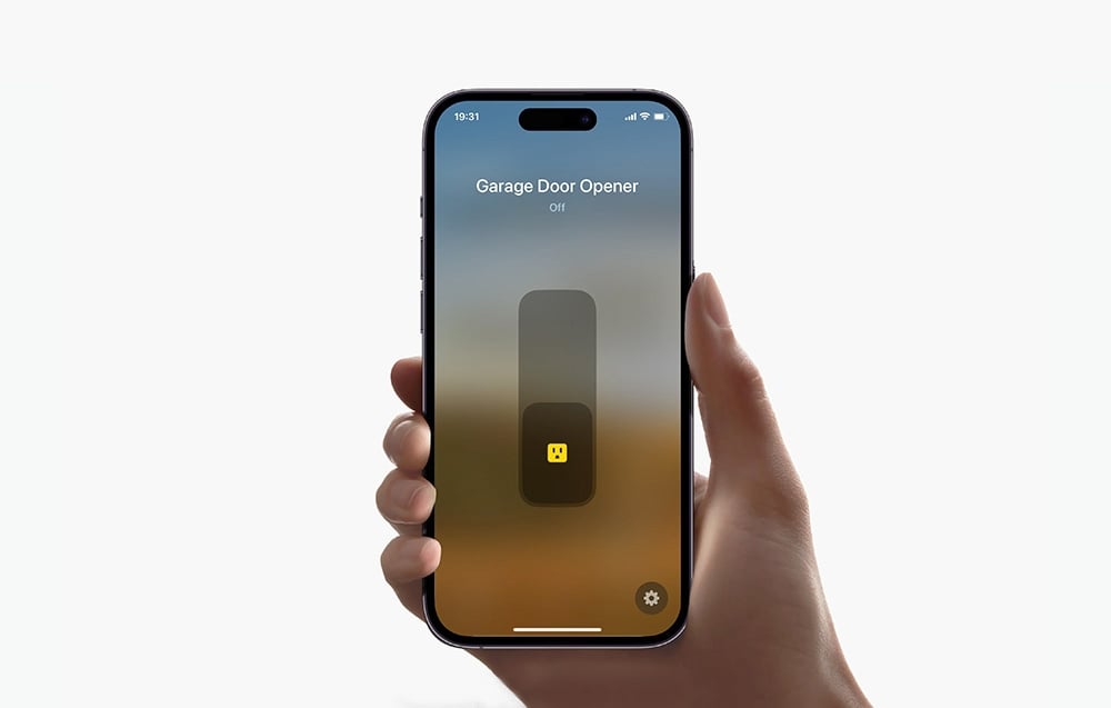 Smartphone with app controlling garage door opener on screen