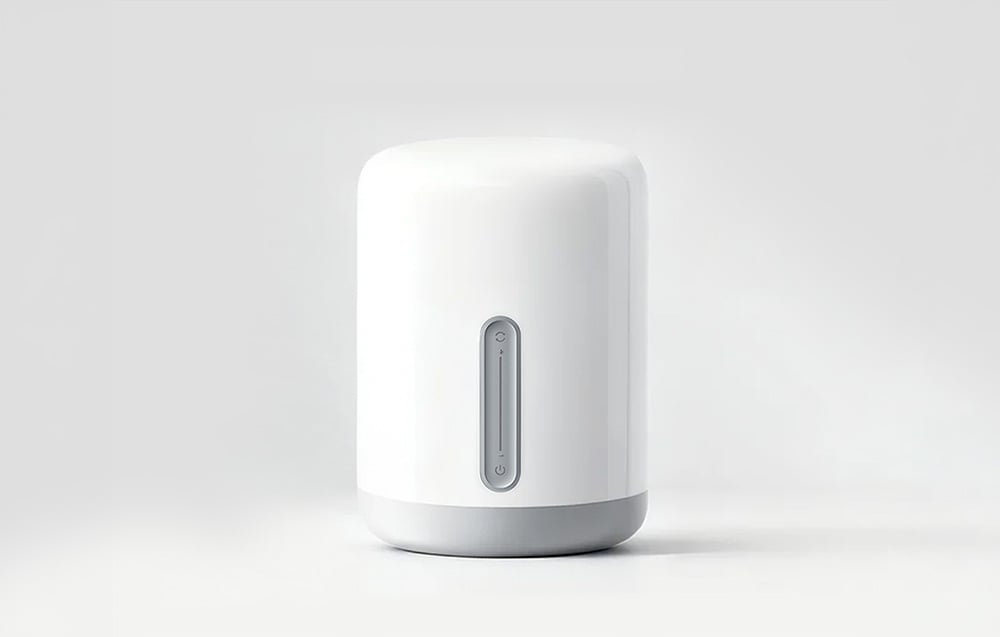A smart night light in white, turned off, displayed against a light-colored studio background