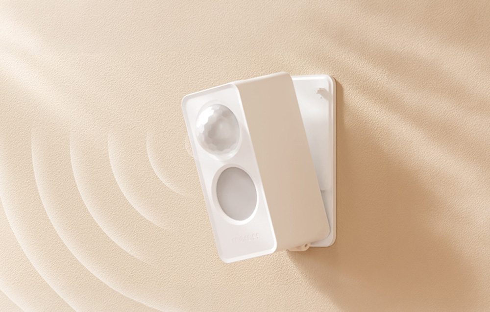 Smart presence sensor mounted on a light-colored wall