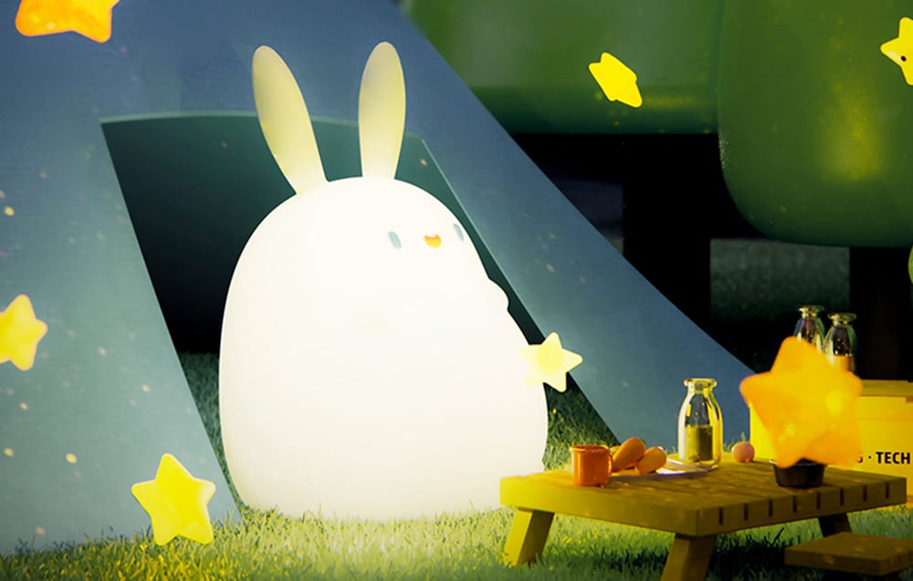 SuperFire RAB-02 Little Rabbit children's night lamp surrounded by a tiny table and glowing stars.