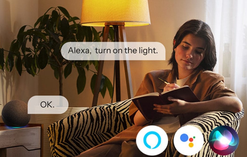 Woman on couch uses Alexa voice commands to control living room lights