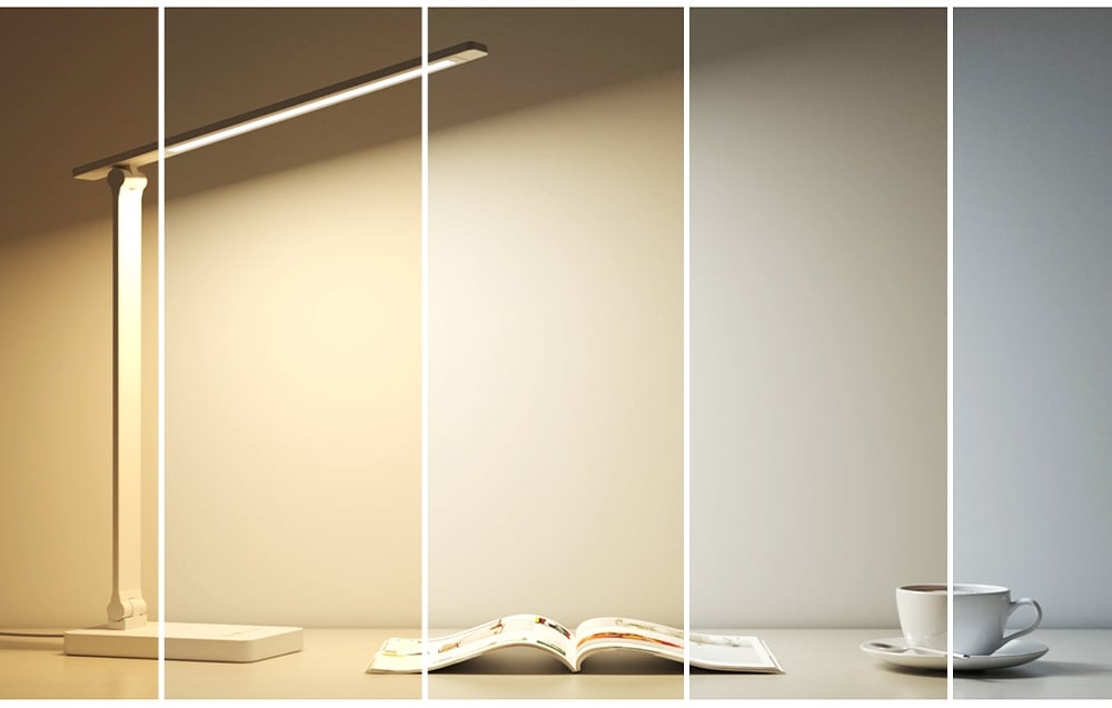 A collage of five vertical strips showing a desk lamp changing the color of its light from warm yellow to cool white.