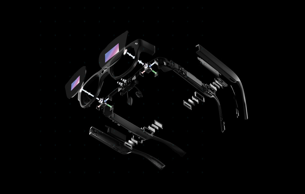 A detailed view of the unfolded components of the AR glasses on a black background.