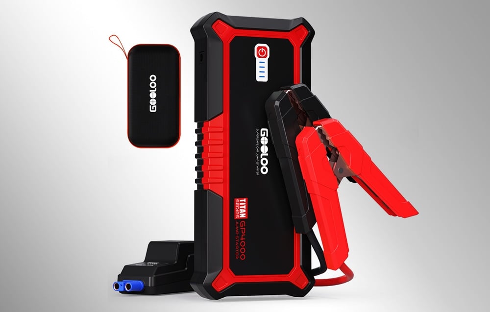 Car starter with protective case standing next to it on a light background