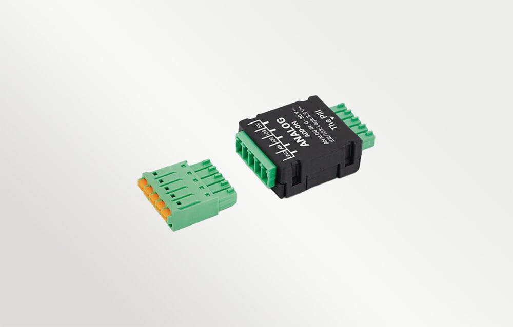 A black housing and a separate green connector with screws on a white background, with visible text on the housing