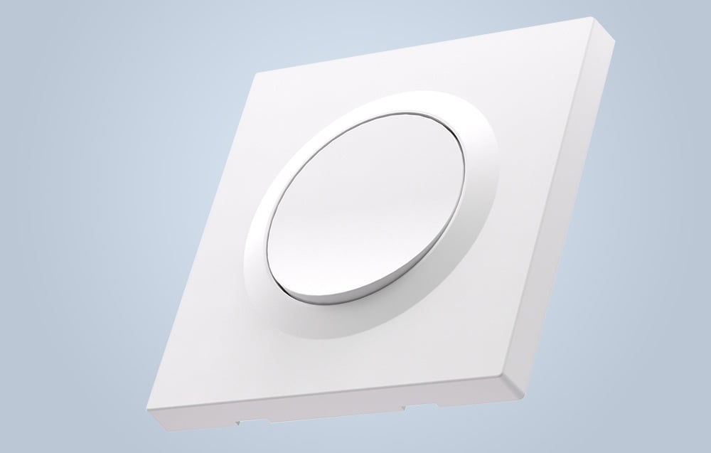 White wall switch on blue background.