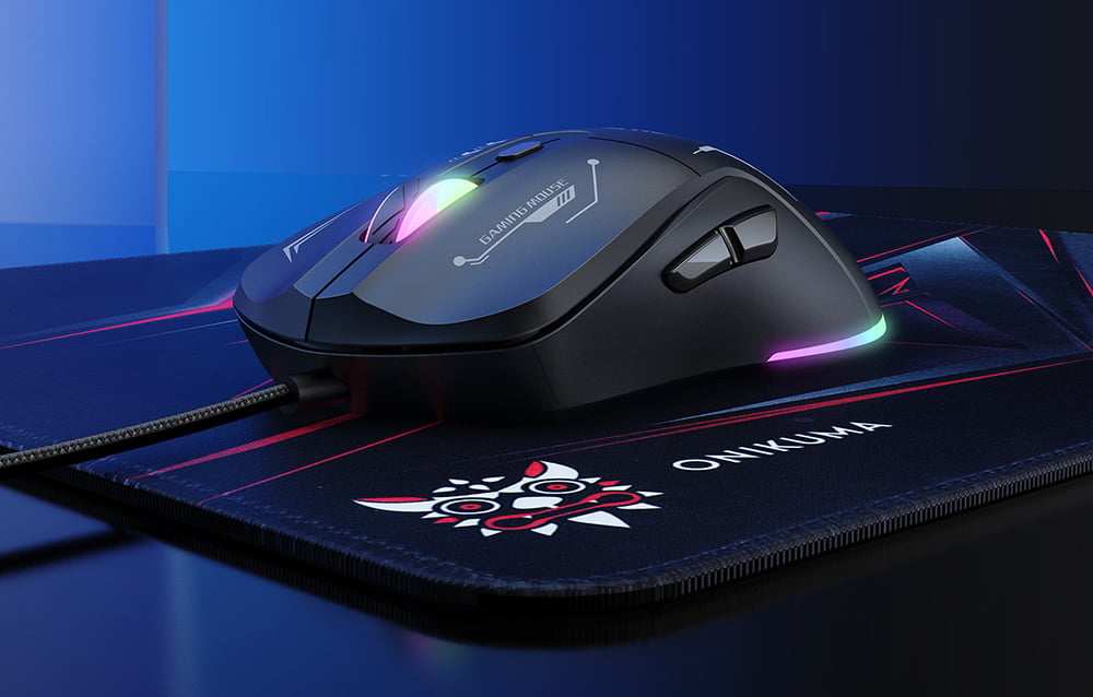 Close-up of the Onikuma mouse with colored backlighting resting on the mouse pad on the desk