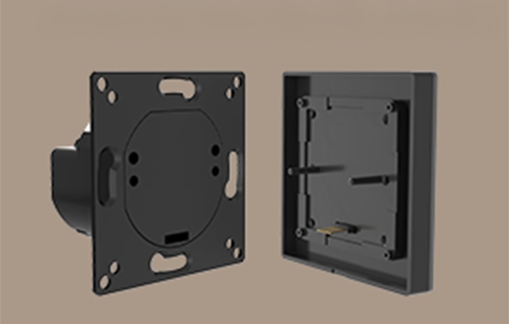 Close-up of the rear of the switch module and the inside of the touch panel with connecting pins.