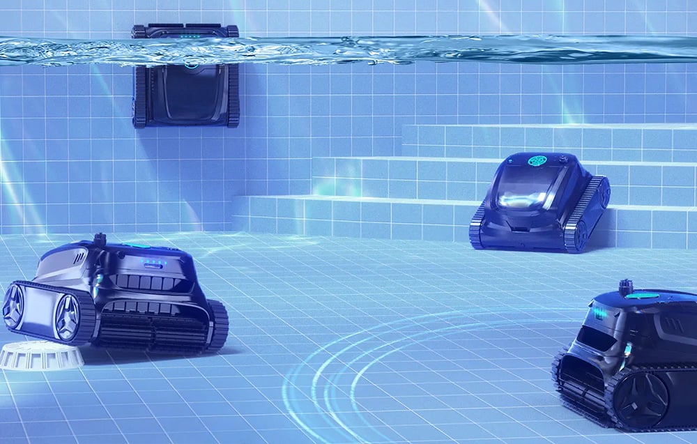 Four pool robots Wybot underwater on blue pool bottom