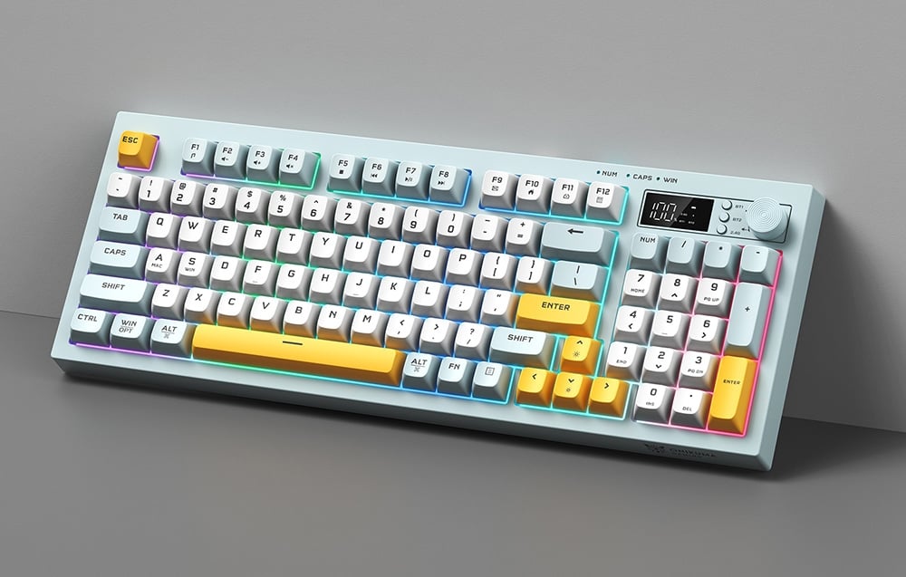 Gaming keyboard with colorful keys and LCD screen based on a gray wall