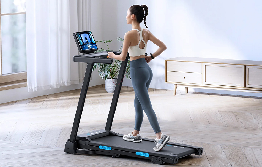 Woman exercising on a Merach treadmill in a modern, bright living room