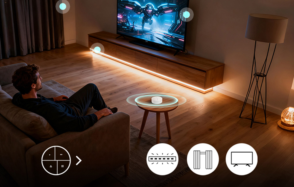 A man watches a movie while sitting on the couch, a smart button lies on the table
