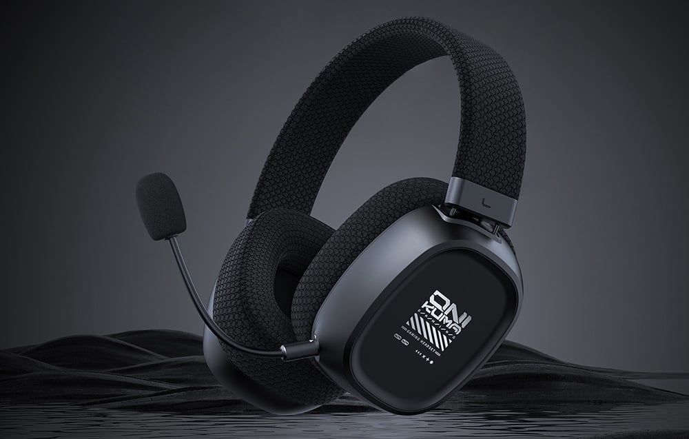 Black gaming headphones with microphone on dark background