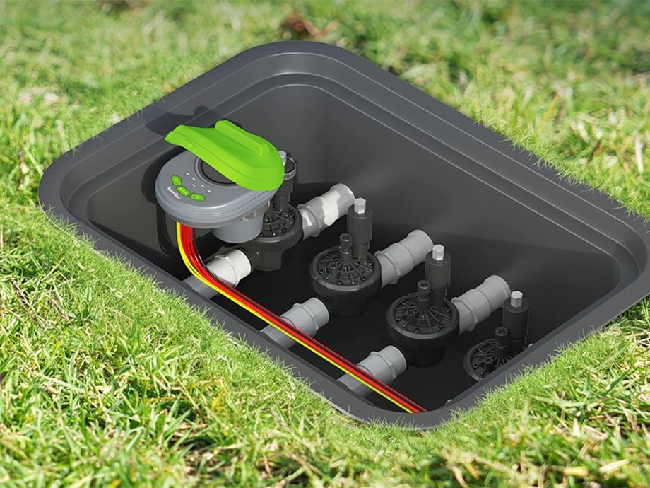 RainPoint sprinkler controller mounted in lawn box, connected to valves and wires.