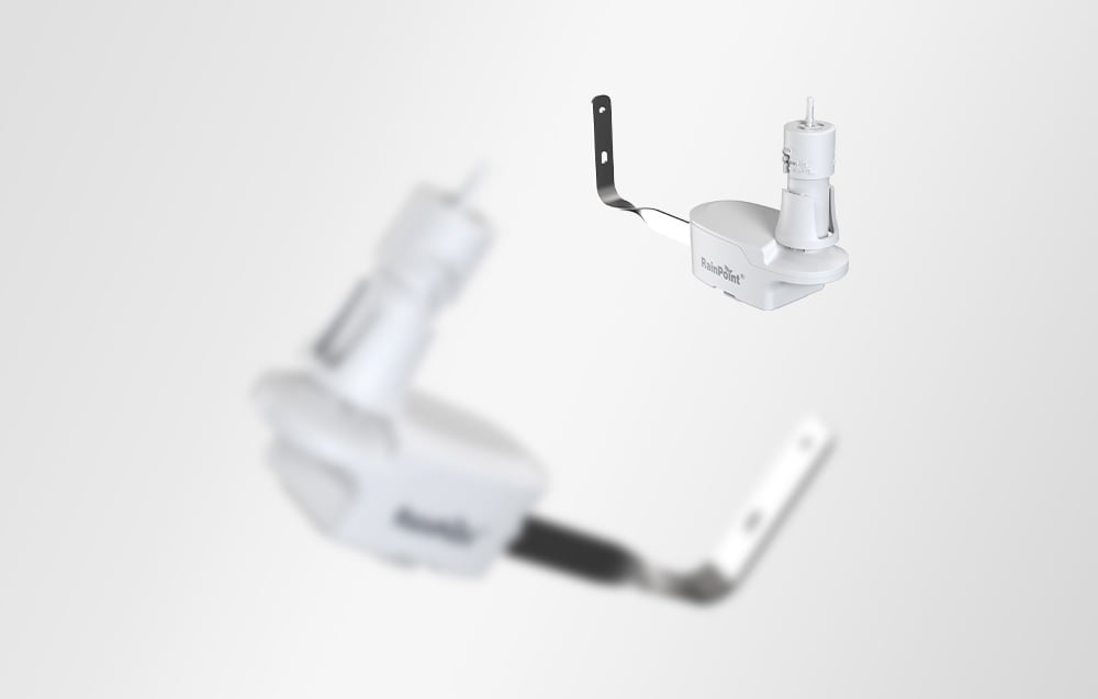 RainPoint rain sensor in the upper right corner; an out-of-focus outline of the device in the foreground