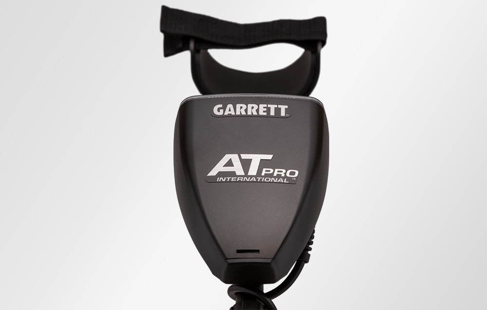 Rear view of metal detector housing with logo.