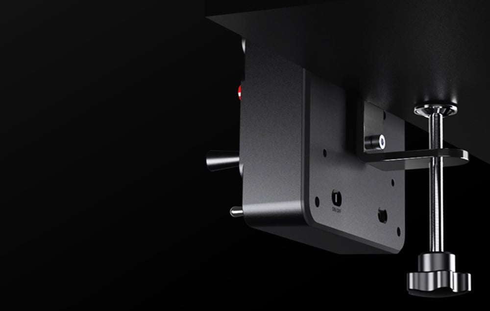 Button panel attached to the desk.
