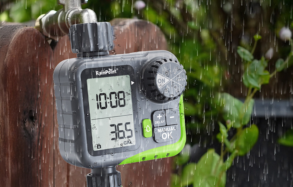 RainPoint irrigation controller during rain; visible water droplets highlight the device’s water resistance