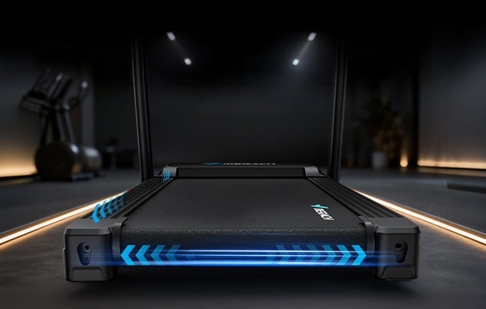 Merach treadmill running belt in a dark interior showing the width of the belt