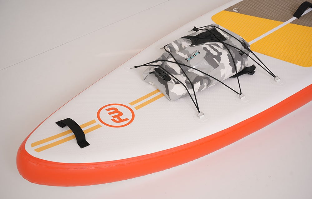 Close-up of a colorful surfboard with straps for a backpack