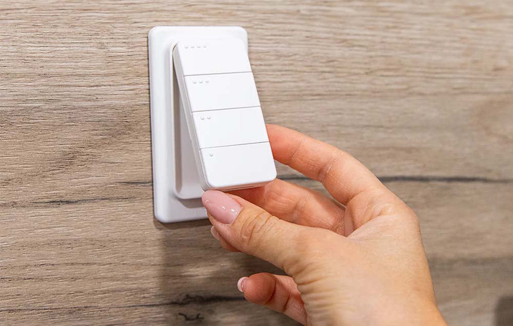 Smart remote control removed from a special holder attached to the wall