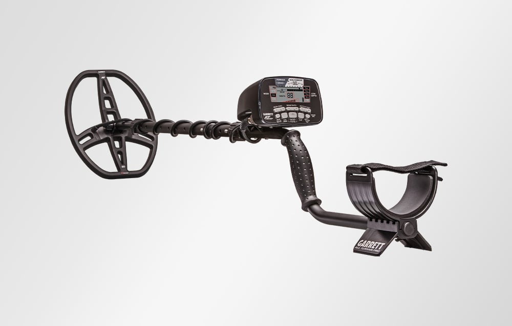 Metal detector with coil on white background.