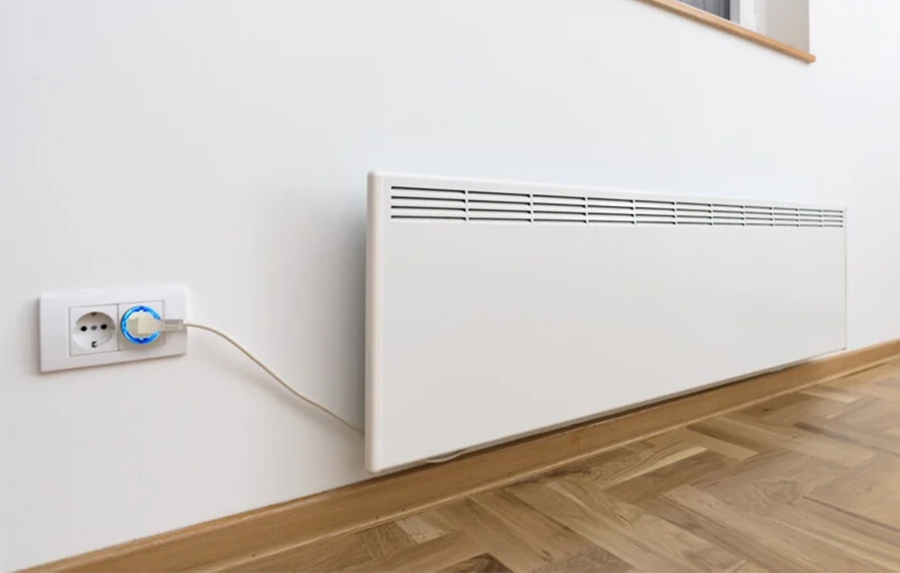 Shelly Plug S with blue light connected to an electric heater against a white wall