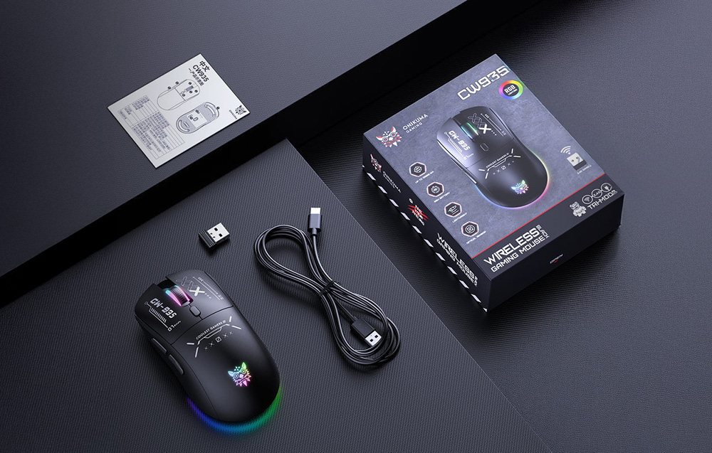 Black gaming mouse, cable, receiver manual and box on black bases