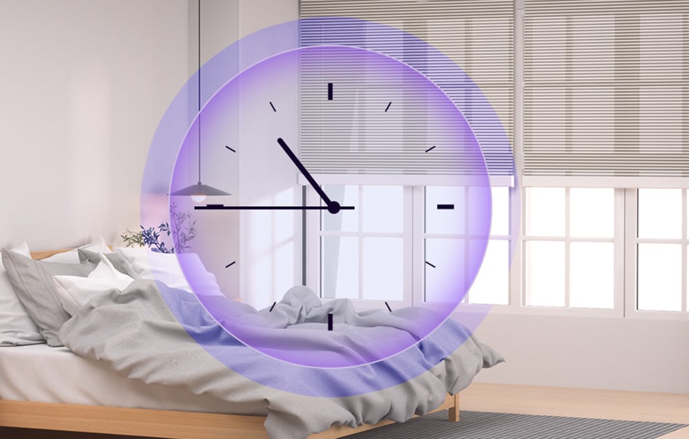 Bedroom with bed and blinds at window with applied clock graphic in purple circle
