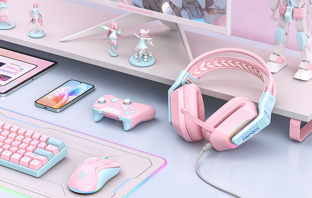 In-ear headphones lying on a desk next to electronic devices and collectible figurines