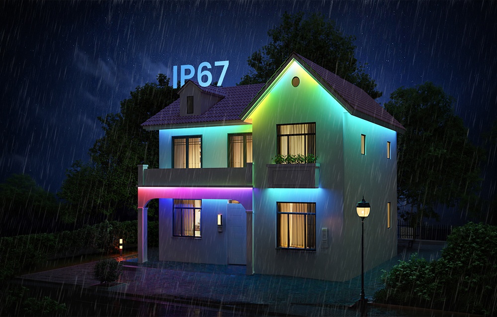 A white, illuminated house in the rain, with the text