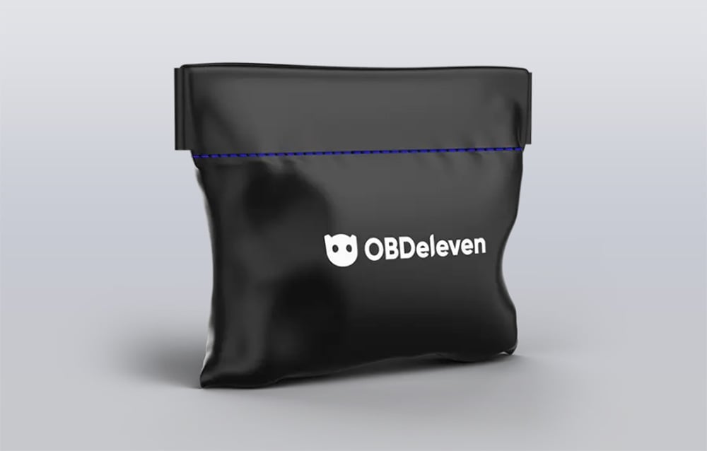 Black cover for the OBDeleven diagnostic interface on a gray background