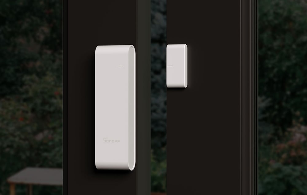 Sonoff door and window sensor mounted on a balcony door frame