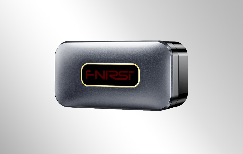 FNIRSI OBD2 diagnostic interface in a gray housing with a gold-bordered logo on a dark background