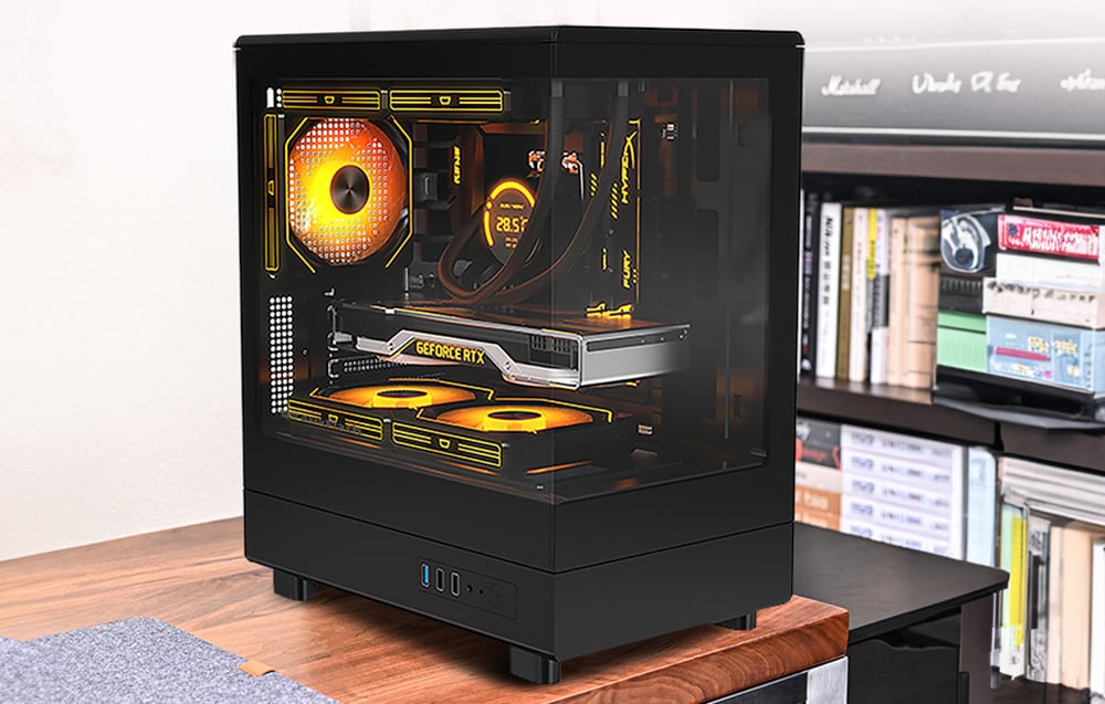 black computer case on a cabinet in a room, with a bookshelf in the background